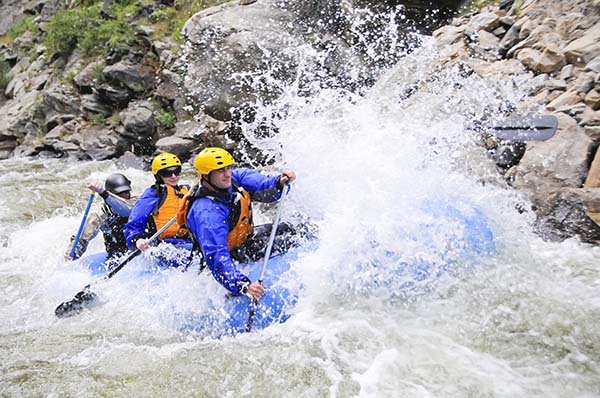 rafting boat filled with adventurers